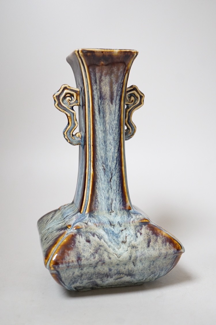 A Chinese Shiwan two handled vase, 23cms high